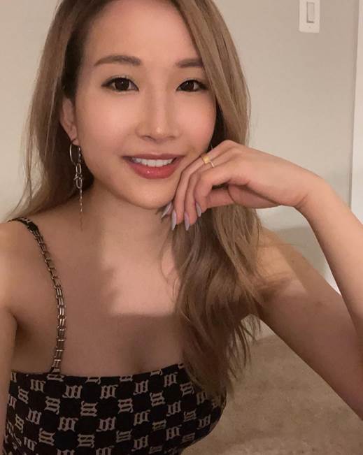 A person taking a selfie

Description automatically generated
